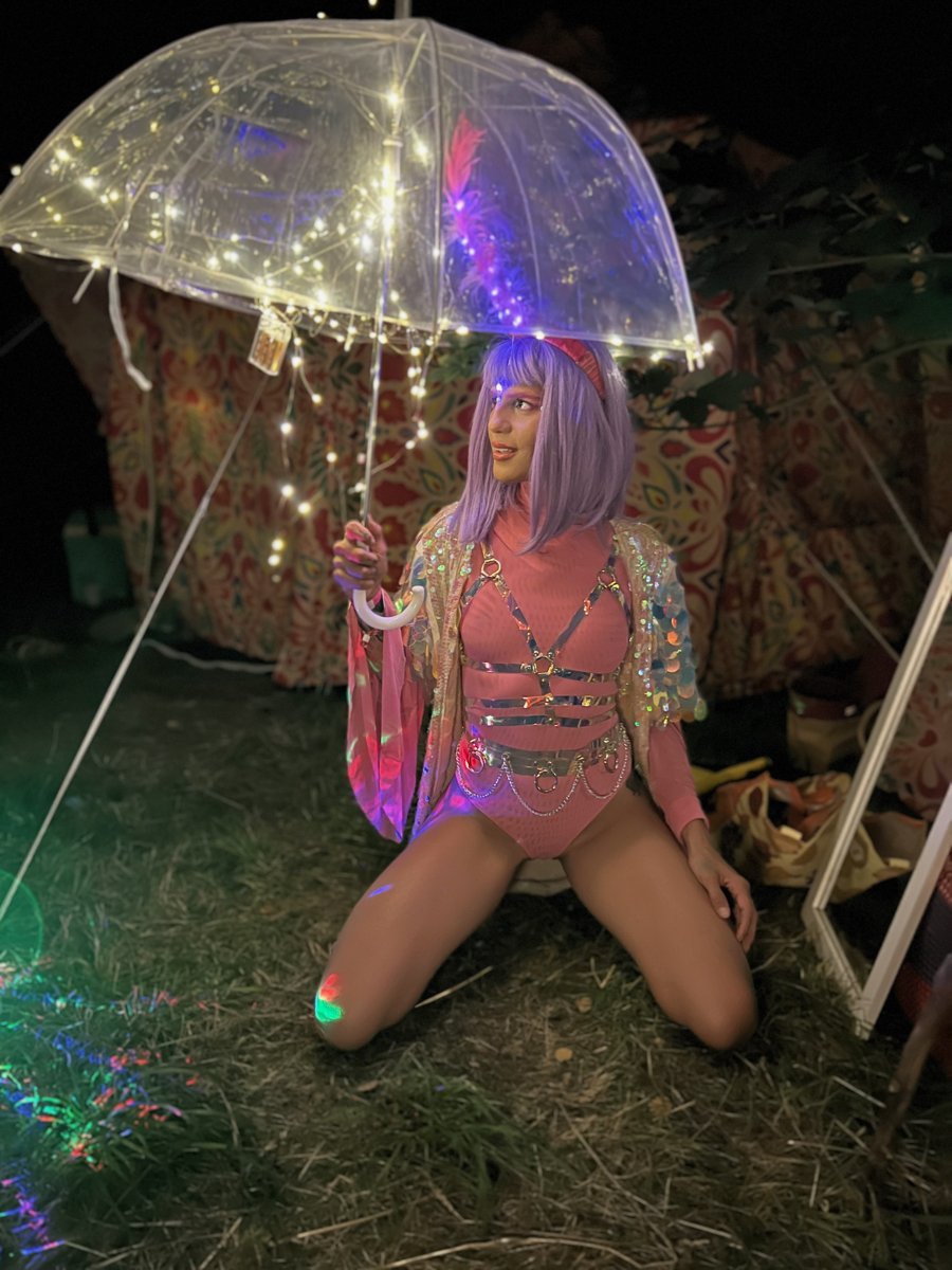 Purple wig and an illuminated umbrella
