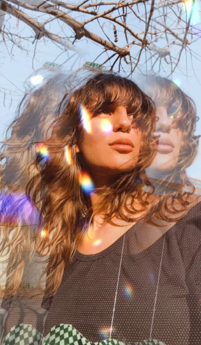 Prismatic light across a portrait